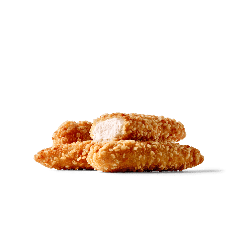 Frittierte und knusprige Hähnchenstreifen auf einem grünen Hintergrund