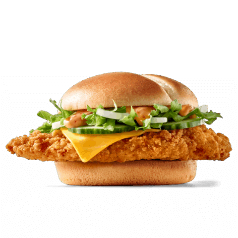 Saftiger Hühnchenburger mit knuspriger Panade, Cheddar-Käse und frischem Gemüse auf einem Brötchen